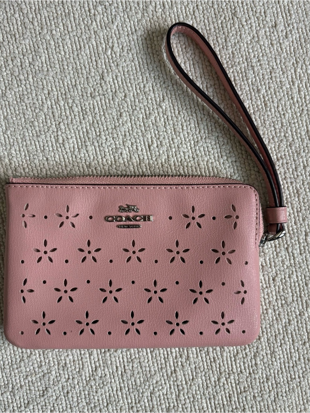 COACH Pink Perforated Leather Wristlet with Floral Cutouts